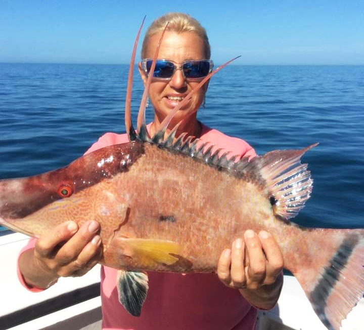 Lady holding a large fish