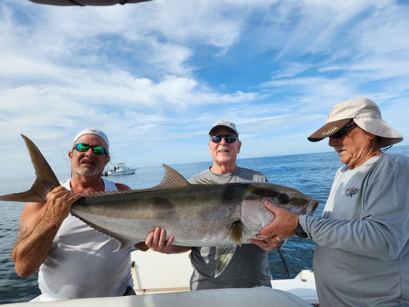 guys holding a fish
